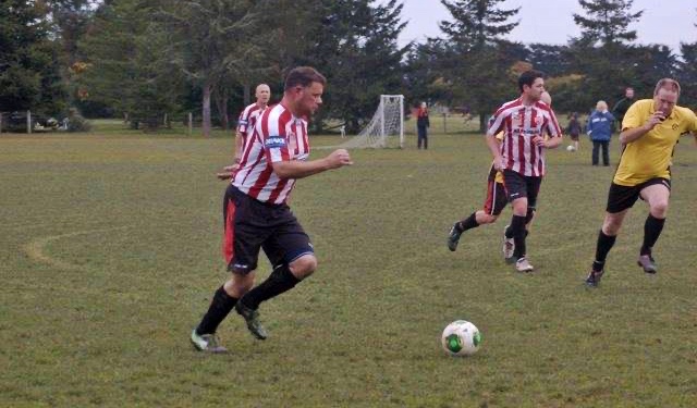 David Yardley playing football with his team, the Waimak Mud Dogs.