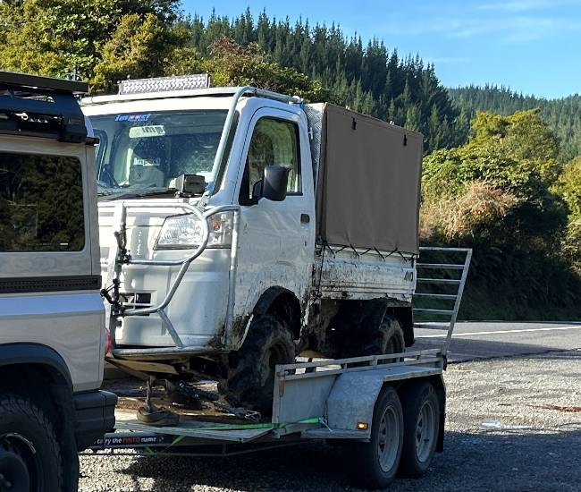 4WD side-by-side hunting vehicle on trailer