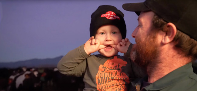 Cow Manager NZ farmer customer with cheeky child